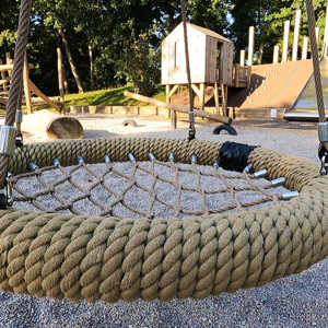 A photograph of the netted-seat swing, in the Natural Play Area at Russell Gardens.