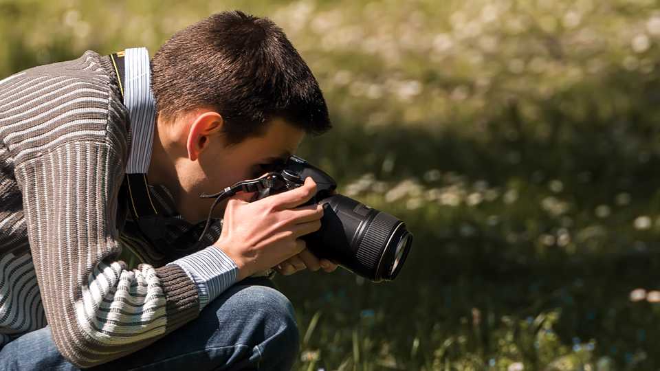 A person capturing a photograph.