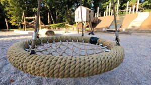 A photograph of the netted-seat swing, in the Natural Play Area at Russell Gardens.